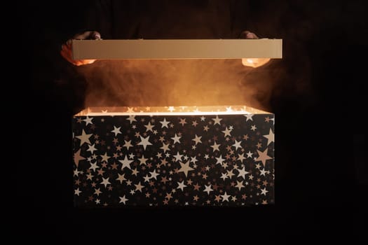 magic surprise box on dark background with smoke, discount and sale concept, magic gift