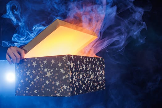 magic surprise box on dark background with smoke, discount and sale concept, magic gift