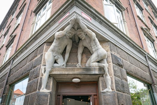 Fredericia, Jutland, Denmark,aug 13, 2024 - nice art with concrete statute above door entrance