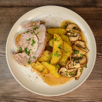 RECIPE VEAL ROAST, FRIES AND MUSHROOMS WITH SAUCE. High quality photo