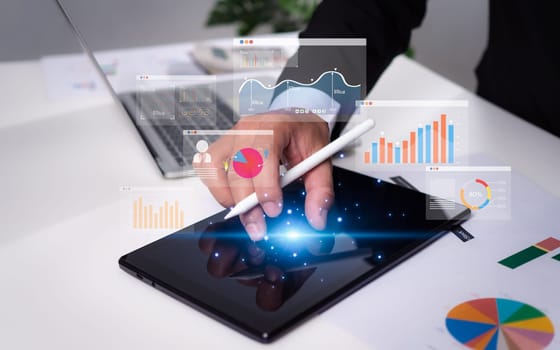 Business people use tablet to analyze business and manage corporate data, business analytics with charts, metrics and KPIs to improve organizational performance, marketing, finance strategy.