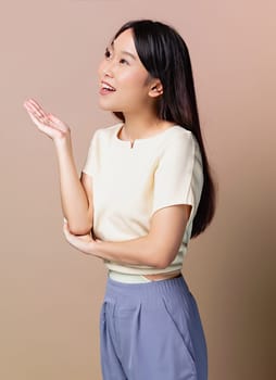 Portrait of young beautiful Asian lady smiling with cheerful expression, shows something amazing at blank space banner background poster wallpaper. AI Generative.