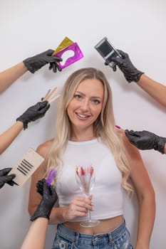 Portrait of caucasian woman and masters hands with eyelash extension tools