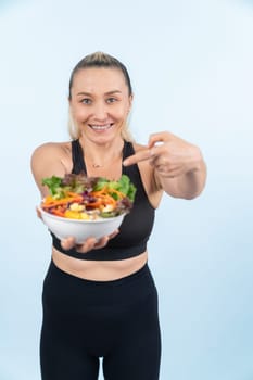 Happy smile senior woman portrait holding bowl of vegan fruit and vegetable on isolated background. Healthy senior people with healthy vegetarian nutrition and body care lifestyle. Clout