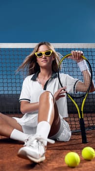 Tennis player with racket. Download a photo of a tennis player in a neon glow to advertise sporting events. Sports betting online in a mobile application