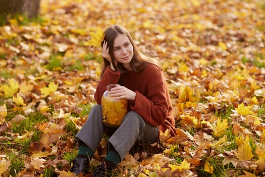 girl enjoying warm autumn in the park, hello autumn, autumn mood