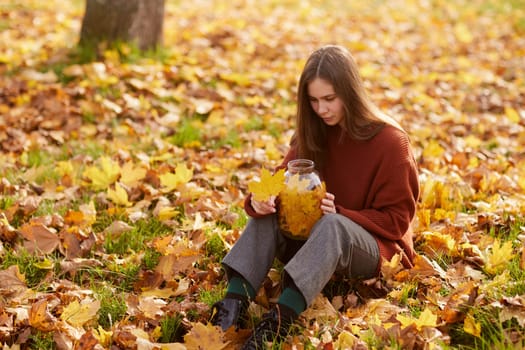 girl enjoying warm autumn in the park, hello autumn, autumn mood