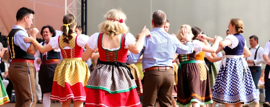 A lively group of dancers, dressed in colorful traditional attire, performs in unison at a cultural festival. The joyful atmosphere highlights the community's rich heritage and traditions.