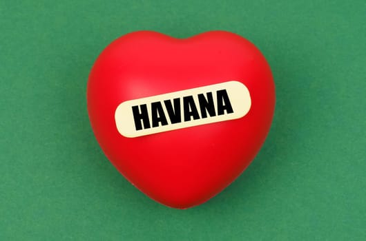 A bright red heart with Havana inscribed showcases the capital's charm, symbolizing affection and connection to the city.