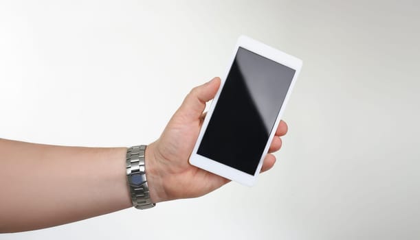 Close-up of man hold cellphone with locked or turned off black screen. Mobile phone not work, useless gadget model. Mockup, technology concept. Copy space