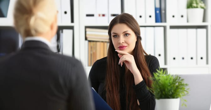 Portrait of man and smiling mature woman talking in office discuss working moment. Client or companion support partner in decision. Success, career concept