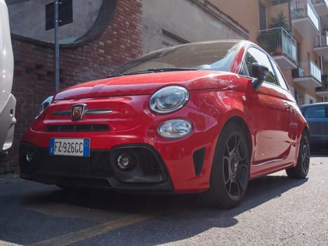Cremona, Italy August 31st 2024 A red fiat 595 competizione parked on a city street, showcasing its sporty design and italian craftsmanship