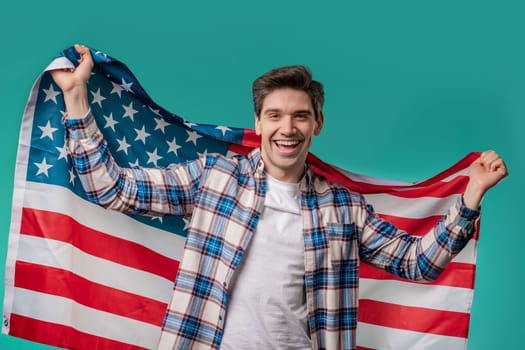 Happy man with national USA flag on blue background. American patriot, 4th of July - Independence day celebration, election, America, labor. US banner. High quality