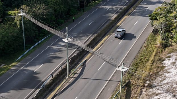 mata de sao joao, bahia, brazil - september 9, 2024: View of a wild animal flyover on the BA 099 highway in the Praia do Forte region.