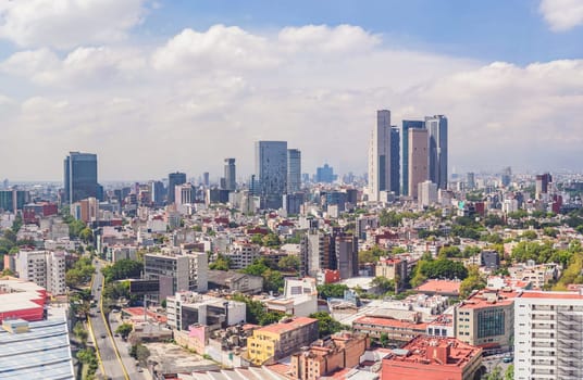 Panoramic view of Mexico City from above, showcasing the sprawling urban landscape, iconic landmarks, and vibrant culture. Cityscape, travel, and architecture concept.