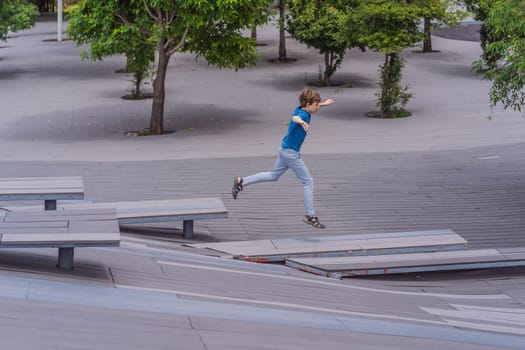 Teenage boy doing parkour in a park. Adventure, movement, and urban sport concept.