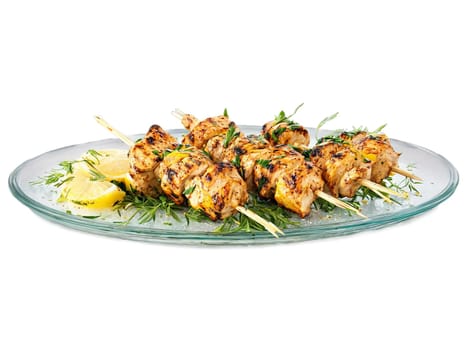 Summer grill lemon herb marinated chicken skewers served on a transparent glass plate zesty. Food isolated on transparent background.