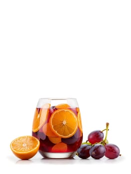 Glass of bright red Spanish Sangria with floating orange slices and green grapes. Drink isolated on transparent background.