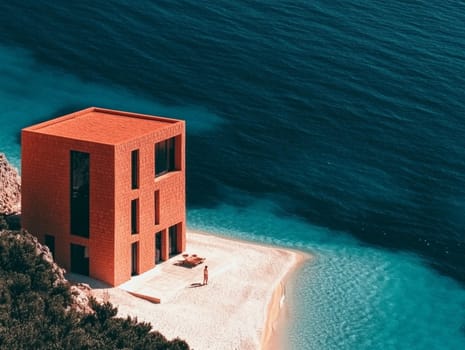Woman in swimwear is enjoying the summer heat on a secluded beach with turquoise water and a modern, minimalist red cube house