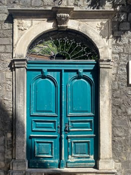 Ancient door in the wall of St. Tryphon's Cathedral, Kotor, Montenegro. High quality photo