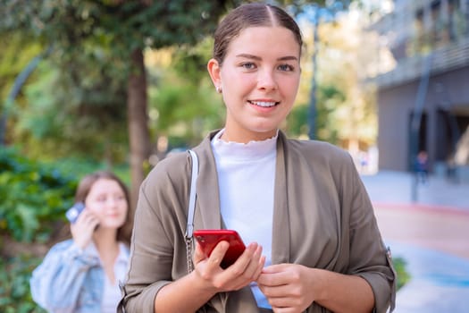 Caucasian woman hands typing on phone browsing telephone on social media.