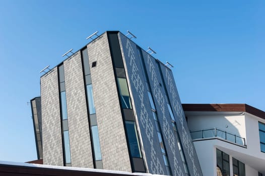 office building with white walls on blue sky