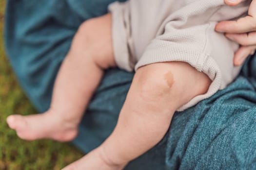 Tiny baby feet, adorned with a charming birthmark, explore the world outdoors, symbolizing innocence and the beauty of new beginnings.