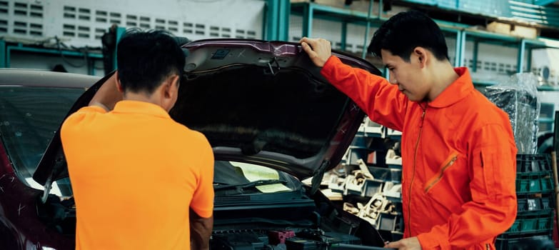 Panoramic banner automotive service mechanic inspect and diagnose car engine issue, repairing and fixing problem in workshop. Technician car care maintenance working on internal components. Oxus