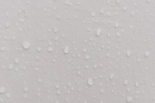 Water drops an gray surface. Abstract water drops background