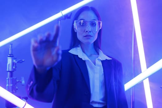 virtual girl in transparent glasses in a futuristic space surrounded by neon lights, cyberspace