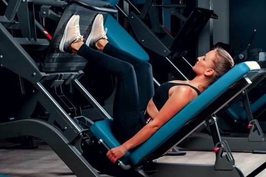 Slim girl working out in training apparatus