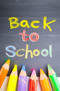 Back to School with Colored Pencils on Chalkboard for Creative Learning