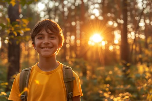 Boy smiling in a beautiful forest with golden sunlight during sunset, enjoying nature and outdoors exploration