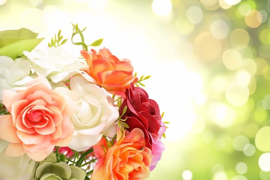 Beautiful bouquet with vibrant roses, petals, and blooming flowers in a colorful garden setting.