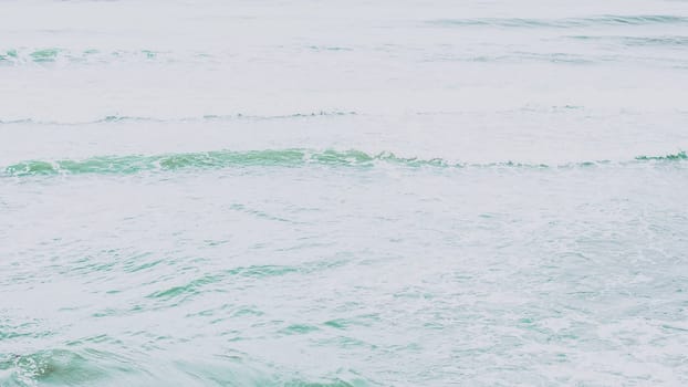 Real photo sea water waves, abstract background, nature power, pale light contrast green matte more tone in stock.