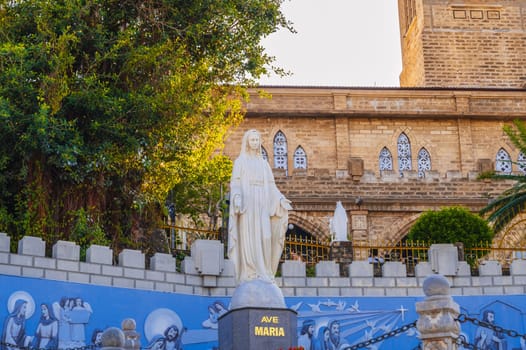 Sculpture of Saint Maria in the square of Nha Trang Cathedral or Stone Church or Christ the King Cathedral in Asia. Nha Trang, Vietnam - August 22, 2024