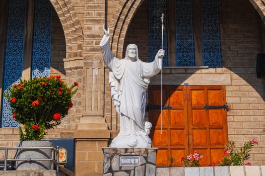 Statue of Jesus Christ in square of Nha Trang Cathedral or Stone Church or Christ the King Cathedral in Asia. Nha Trang, Vietnam - August 22, 2024