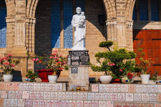Statue of Saint Apostle in the square of Nha Trang Cathedral or Stone Church or Christ the King Cathedral in Asia. Nha Trang, Vietnam - August 22, 2024