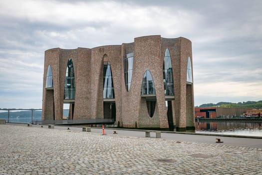 The iconic Fjordenhus between two houses in the harbour basin of Vejle, Denmark,