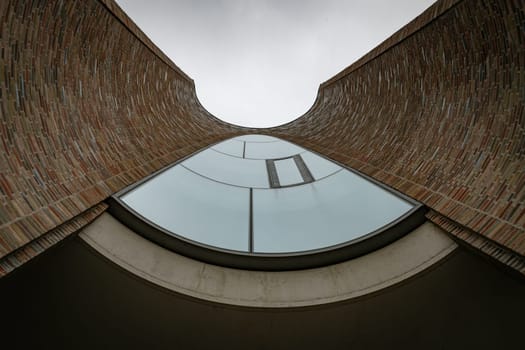 view in the iconic Fjordenhus between two houses in the harbour basin of Vejle, Denmark, from the floor to the roof view
