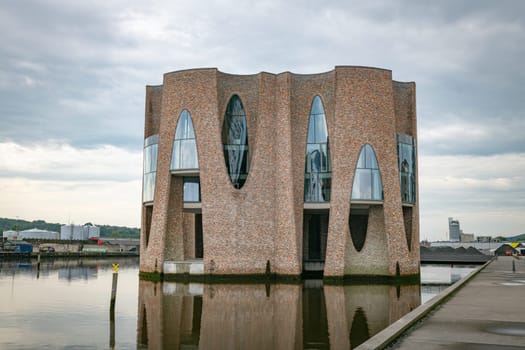 The iconic Fjordenhus between two houses in the harbour basin of Vejle, Denmark,