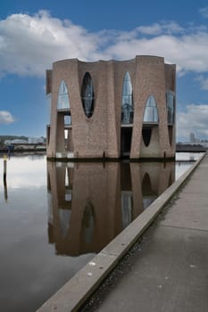 The iconic Fjordenhus between two houses in the harbour basin of Vejle, Denmark,