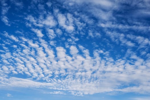 blue sky with white cirrus-cumulus clouds on a winter day