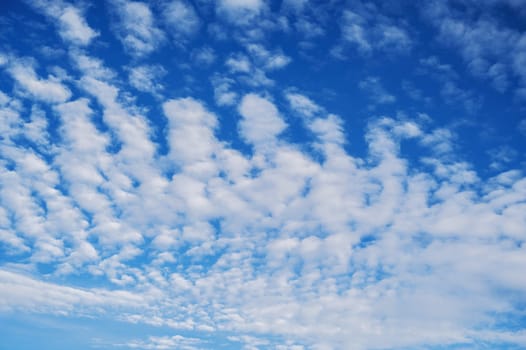 blue sky with white cirrus-cumulus clouds on a winter day