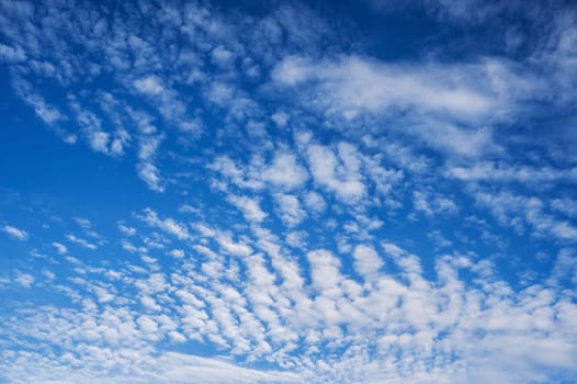 blue sky with white cirrus-cumulus clouds on a winter day