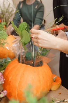 Creating a floral composition in a pumpkin. Making decor with your own hands