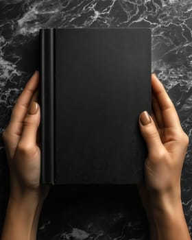3d black book with blank cover on dark background. Selective focus.