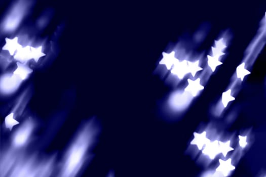 Blurry garland lights on a dark background. Festive Christmas and New Year background. Soft focus.