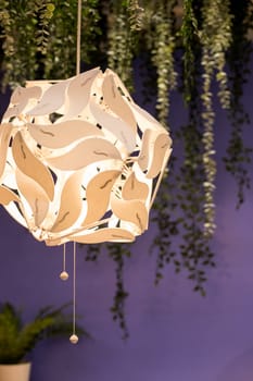 Beautiful geometric modern ceiling lamp interior contemporary decoration isolated on a dark background.
