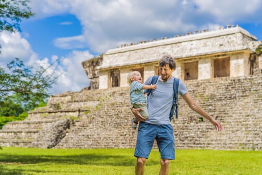 Mother with his toddler son exploring the ancient pyramids of Palenque, Mexico, surrounded by dense jungle. Cultural heritage and adventure travel concept.
